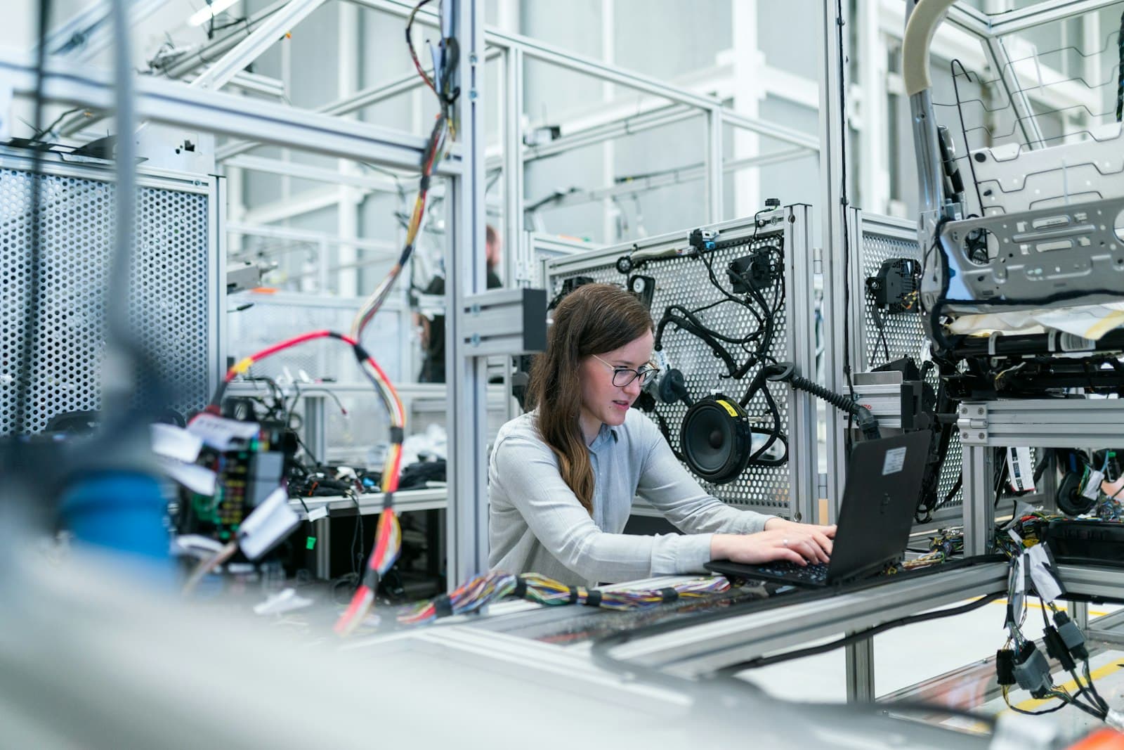 Quality control technician inspecting components in a manufacturing facility